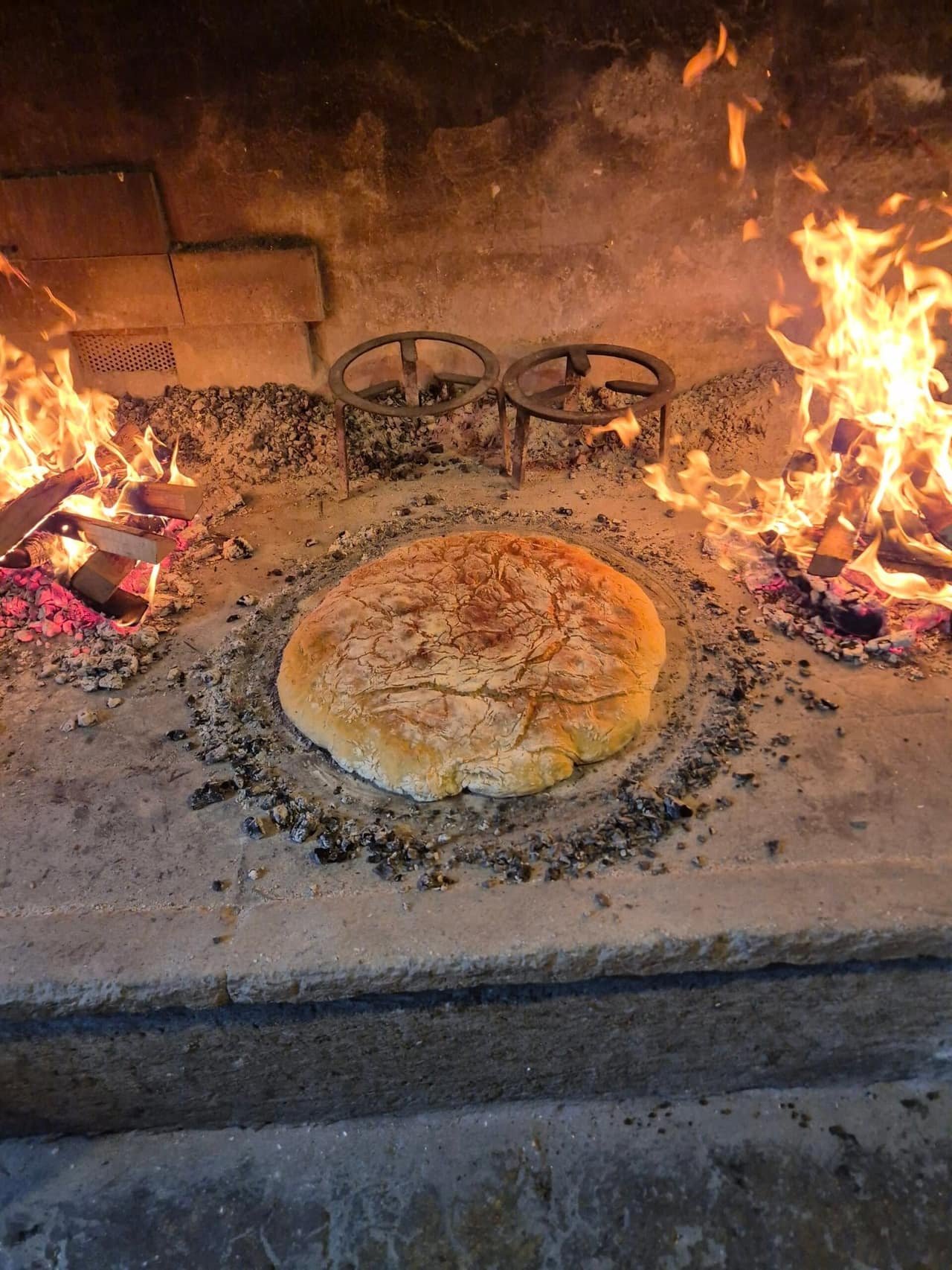Bread baking in the embers of the open hearth